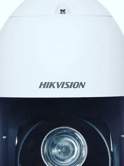 I use modern, high-quality cameras like this Hikvision dome camera. This type is great for providing wide coverage and clear images for both indoor and outdoor security monitoring.