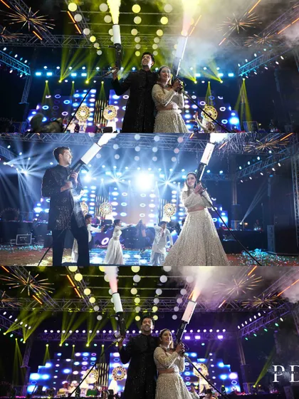 The couple's high-energy stage moment, complete with cold pyro and dramatic lighting. We work to create a stage setup that amplifies the excitement of the performances.