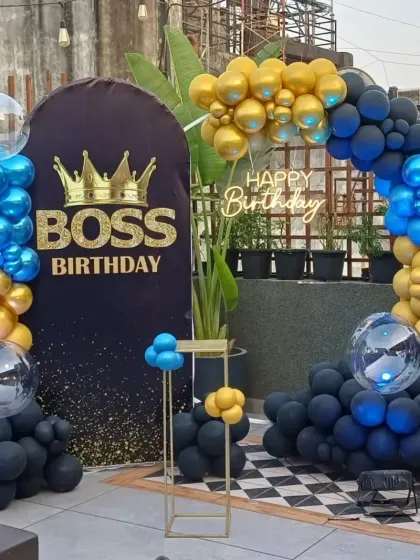 Celebrating a manager or team lead is a big deal in any office. This "Boss Birthday" setup for a corporate client included a custom backdrop, a vibrant balloon arch in blue, black, and gold, and a "Happy Birthday" neon light for the perfect photo opportunity.