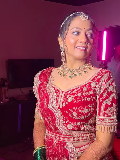 A behind the scenes shot of the bride, showing how the makeup looks under professional lighting.
