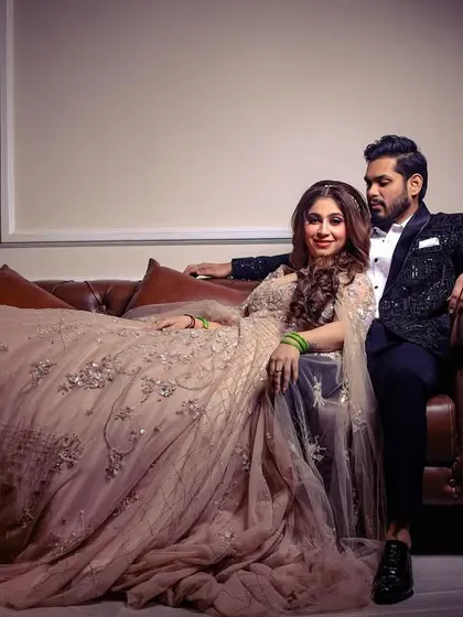 A stylish, posed shot of the engaged couple, exuding elegance and confidence.