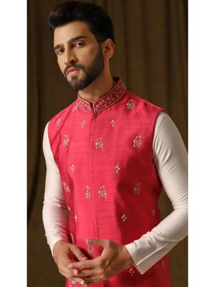 A confident pose in the 'Gulab Dev' bandi set. This shot captures the charm and elegance of the ensemble, designed for a man who is comfortable with color.