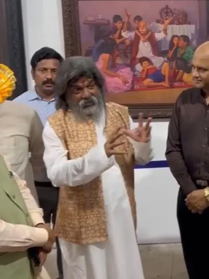 The late, great art director Shri Nitin Desai explaining a painting at an exhibition he organized at his world-famous ND Film Studio, where I was an invited artist.