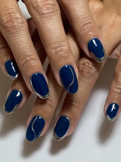 Modern and chic. A deep navy blue base is accented with abstract silver chrome lines for a sophisticated and artistic design.