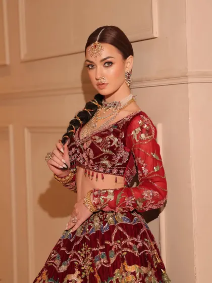 This shot highlights the unique braided hairstyle, a modern twist on a traditional bridal look.