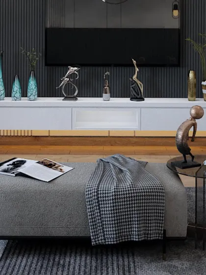 A close-up of a seating area with a stylish ottoman and decorative sculptures, showcasing my attention to detail in furnishing and styling.