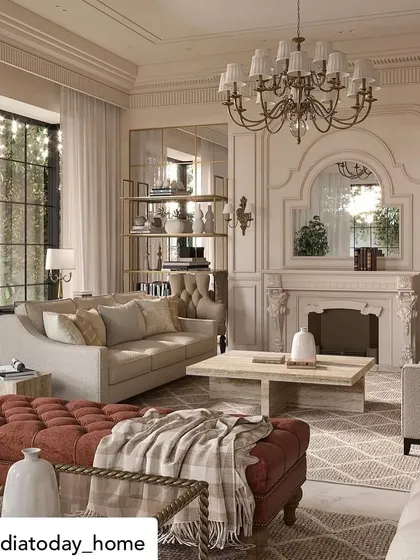 Featured in India Today Home, this living room from "The Colonial House" project showcases a blend of European influences. A deep red ottoman adds a bold touch of color to the otherwise neutral space, centered around a classic fireplace.