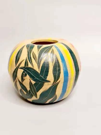 Another one of my pieces for the Clay in Common community project. This one features a sgraffito leaf design with colorful stripes.