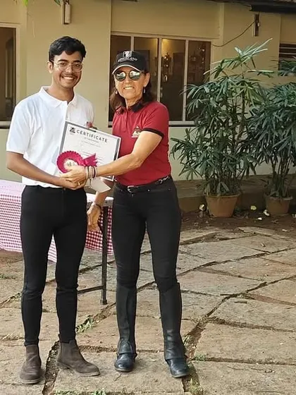 A proud camper receives his certificate at the end of our Summer Camp. These certificates celebrate the skills learned and the wonderful memories made.