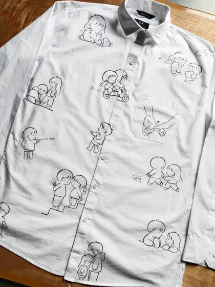 This is what I mean when I say "wear your story". I covered this entire shirt in cute, minimalist doodles that represent a couple's journey and inside jokes. It's a fun and personal way to celebrate your connection.