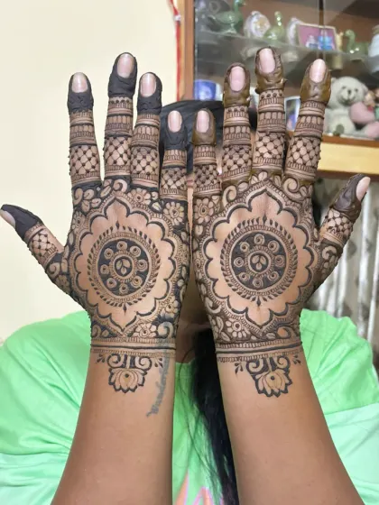 A client showing off her beautiful cutwork mandala designs, a perfect choice for a festive occasion.