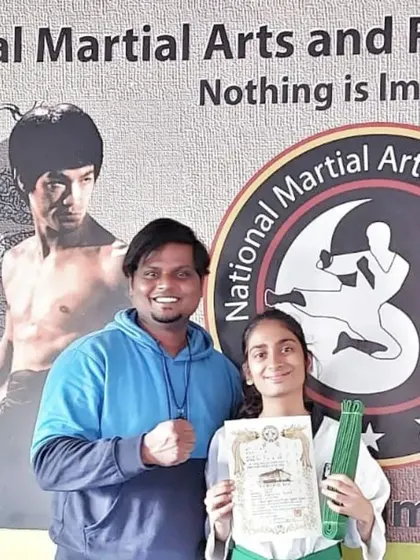 This student is awarded her green belt, marking her steady progress in our program.
