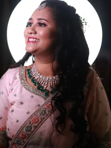 This client looks beautiful in her pink reception outfit and a simple CZ and emerald choker. It’s an elegant choice for a modern celebration.