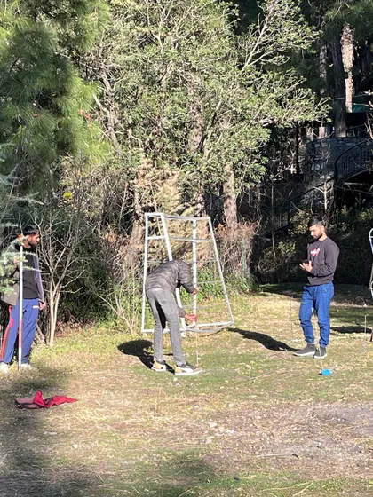 The process of laying out the grid for a new structure on site. This hands-on work is essential for translating the architectural plans from paper to the ground, ensuring the building is placed with sensitivity to its surroundings.