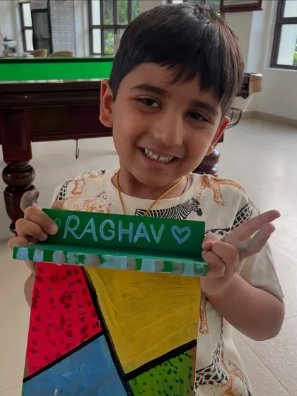 This student painted a colorful nameplate for his dad for Father's Day.
