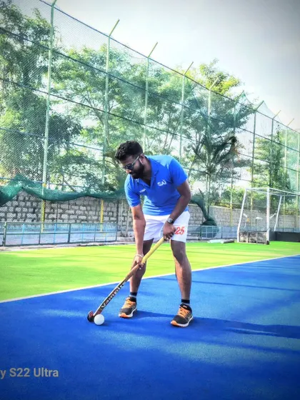 Demonstrating the correct stance and ball position. Fundamentals are the foundation of every great hockey player.