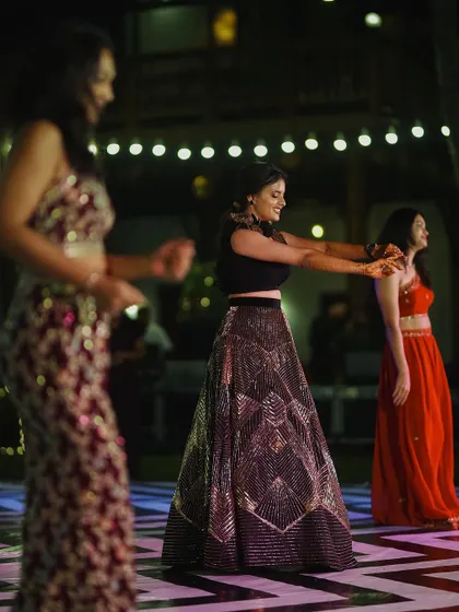 The bride leads a dance performance at her Sangeet. We capture the grace and energy of these choreographed moments, telling the story of your celebration.