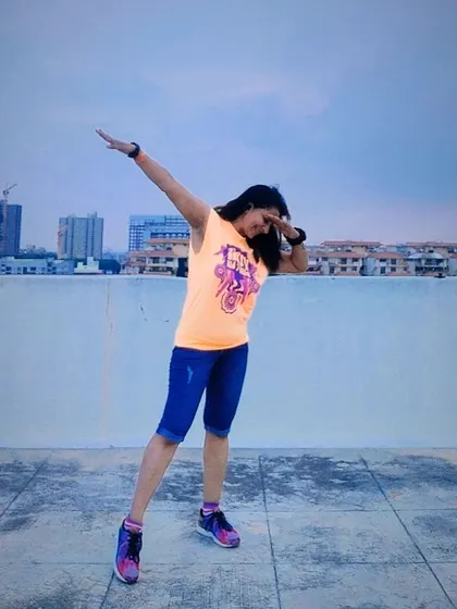 Vibes don't lie. A cool dab pose on a rooftop, enjoying the view and feeling the Zumba energy.