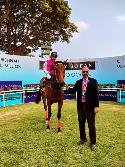 Armstrong, with jockey Imran Chisty, after winning The Champion Trainer Trophy.