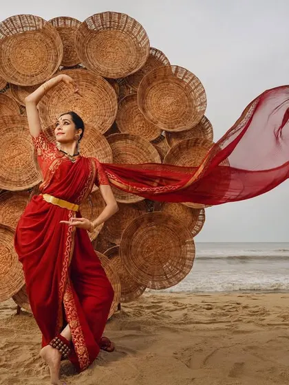 Another shot from the beach collaboration with Amar Ramesh, where a large installation of woven baskets creates a unique, larger-than-life prop against the sea.