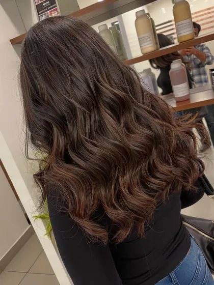 A close-up look at a rich mocha balayage. The deep brown base is enhanced with slightly lighter, hand-painted pieces.