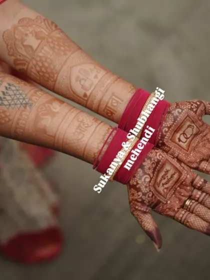 This engagement mehendi is filled with personal touches. It includes the couple's initials, wedding rings, and other symbols that are meaningful to their love story.