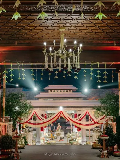 A view from the dining area looking towards the wedding mandap, showing how we integrate traditional elements throughout the entire event space.