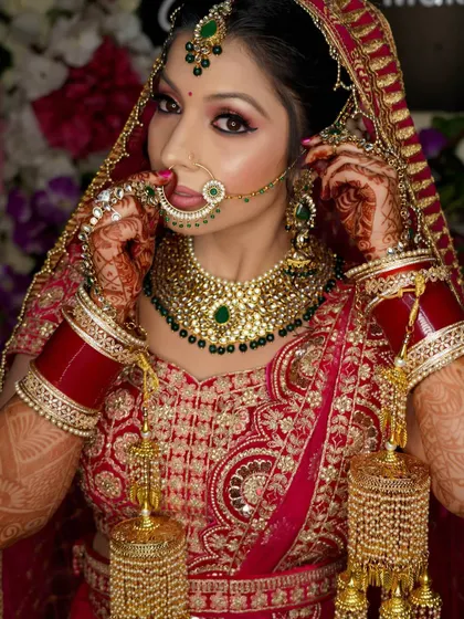 A portrait capturing the bride adjusting her nose ring. These small, detailed actions make for beautiful and natural bridal photos.