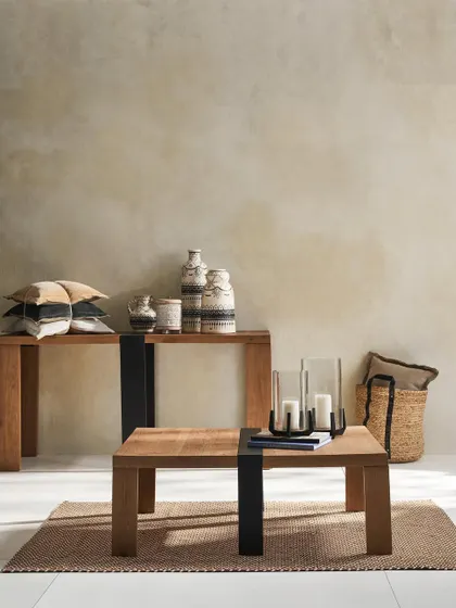 A rustic-modern living room setting featuring a console and coffee table. This shot is designed to showcase multiple pieces in a warm, neutral, and inviting environment.