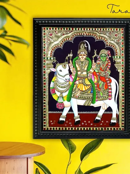 Our Shiva and Parvati on Nandi painting adds a touch of spiritual elegance to this modern space. It serves as a beautiful narrative piece, telling a story of divine love and companionship.