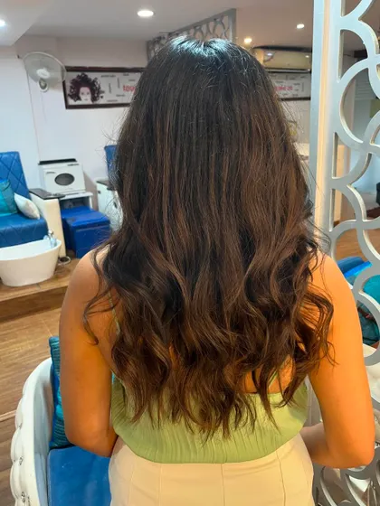 The back view shows the subtle, seamless layers.
