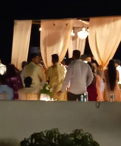 Guests enjoying an outdoor dinner party at a private residence. Our team handles all aspects of catering for house parties, allowing you to be a guest at your own event.