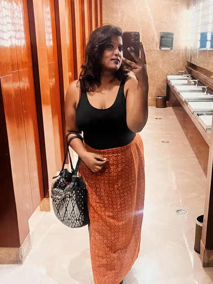 Documenting a beautiful day out. I paired a simple black tank top with a printed wrap skirt for an easy, breezy, and stylish look.