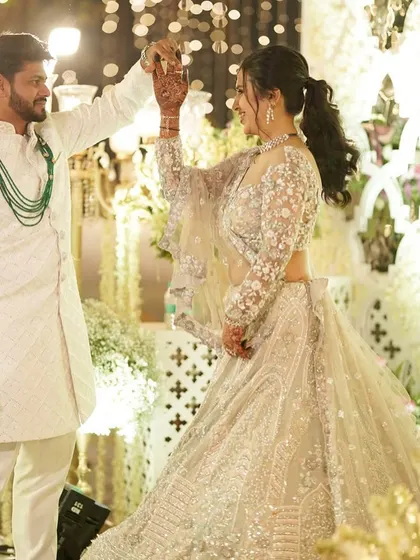 A dance with her partner. Her makeup is set to last through all the fun and festivities of the day.