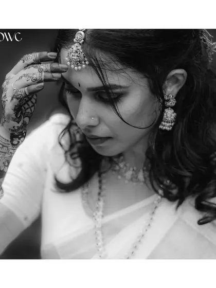 A moody and artistic black and white close-up of the bride.