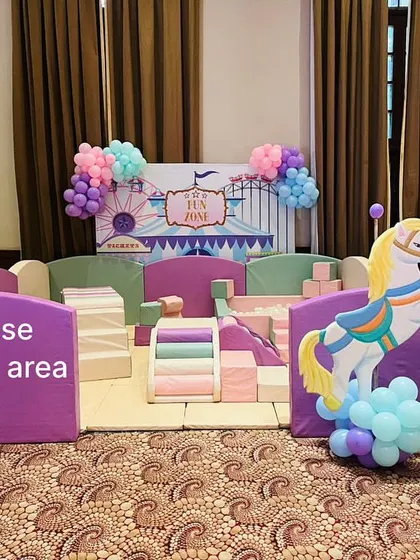 A duplicate image of our pastel play area at a carnival-themed party, showing the setup from a slightly different angle.