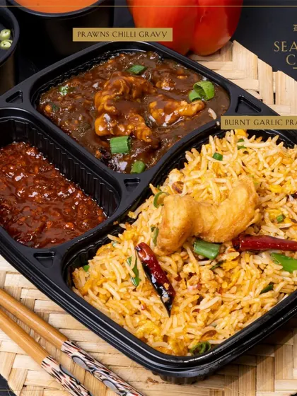 Our Seafood Combo features delicious Burnt Garlic Prawns Rice, a flavorful and aromatic delight for seafood lovers.