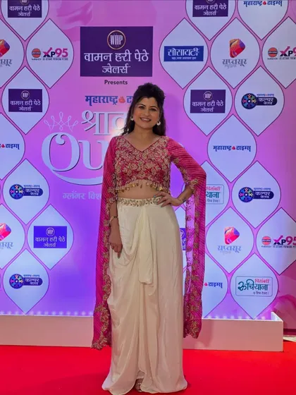 Another shot of the Shrawanqueen Finale look. The makeup is kept soft and glowing to complement the vibrant pink and white outfit.