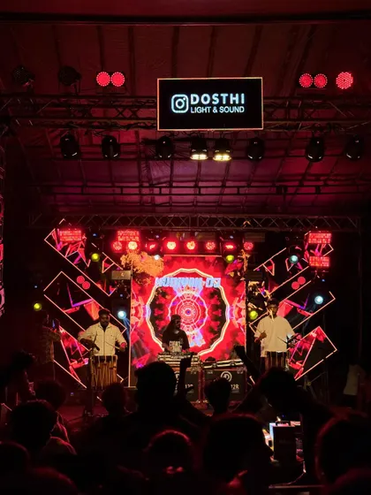A wide shot of the stage, capturing the full production with me, the Chenda artists, and the dynamic LED visuals.
