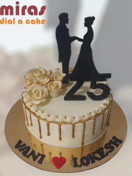 Celebrating 25 years of love with this elegant anniversary cake. The design features a silhouette of a couple, beautiful white roses, and a classy gold drip effect.