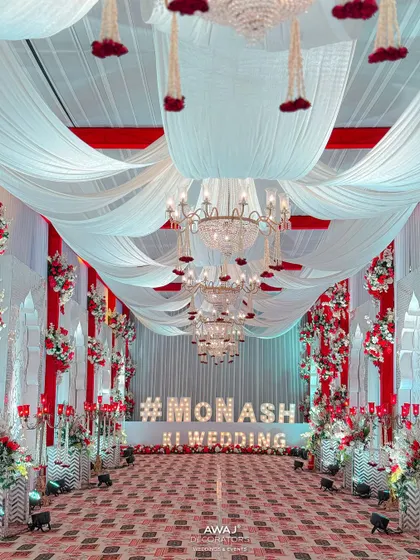 The end of the grand walkway, featuring a large marquee sign with the couple's wedding hashtag.