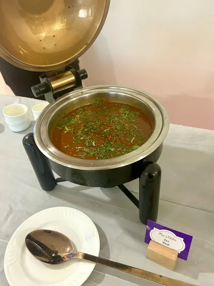 My signature Dal Makhani served in a traditional copper pot. This dish is a crowd favorite and a staple of my North Indian buffet menu.