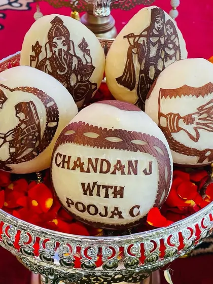 The small details matter the most. I offer personalized coconut carving for engagements and weddings, featuring the couple's names and traditional designs. It’s a unique touch that clients always love.