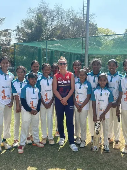 A moment of inspiration. Our young cricketers pose with international superstar Ellyse Perry, learning from one of the best in the world.