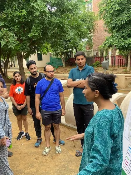 The Salesforce team is briefed at Aravali Creek, learning how the site's innovative flood management system prevents urban flooding while recharging groundwater.