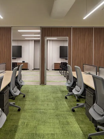 The twin training rooms at the Carlsberg office, featuring sliding-folding partitions for maximum flexibility. This allows the space to transform from two separate rooms into one large hall for company events.