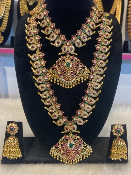 Another variation of our popular mango haram sets. This one features intricate peacock designs and is a favourite for bridal photoshoots.