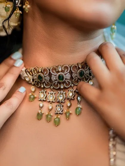Details matter. This close-up on an ornate choker necklace shows our focus on accessory and jewelry photography. We ensure every element of the styling, from the main outfit to the smallest accessory, gets its moment.