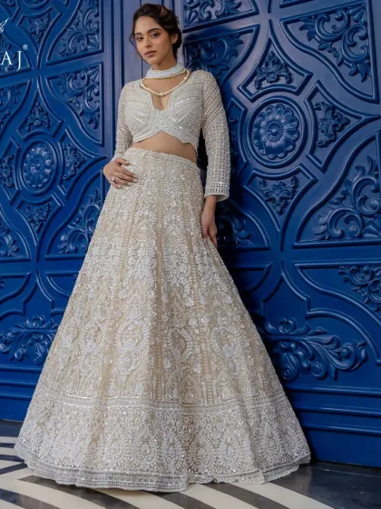 A full view of the ethereal blush lehenga, showcasing its intricate hand-embellishments and timeless design, perfect for the modern bride.