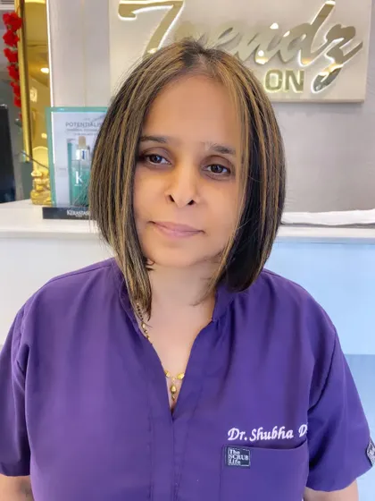 A front-on look at this modern bob with face-framing highlights. It's a powerful, confident style that is easy to maintain.